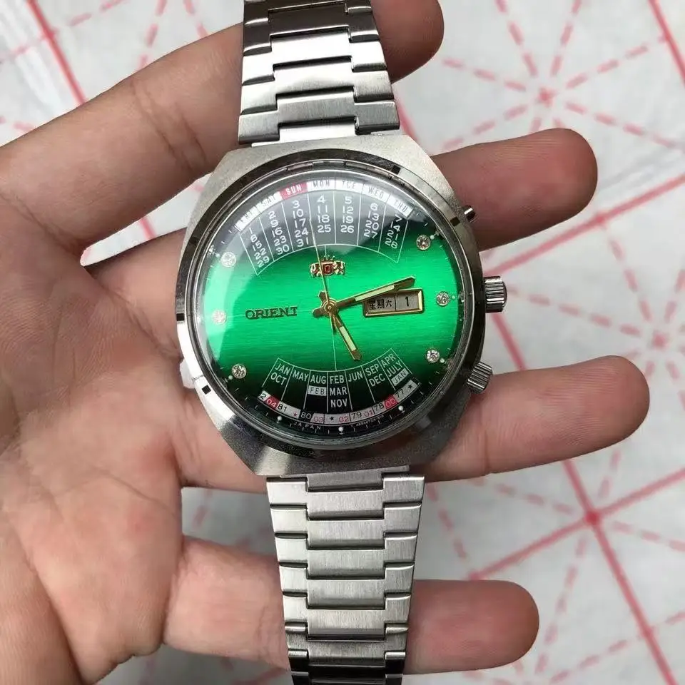 

automatic mechanical unisex Orient watch with rotating large dial, fully functional stainless steel world time