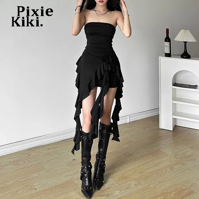 princess polly baby blue dress Pretty happy young stylish woman in trendy black dress with sexy legs and  shoes stands near white wall indoors