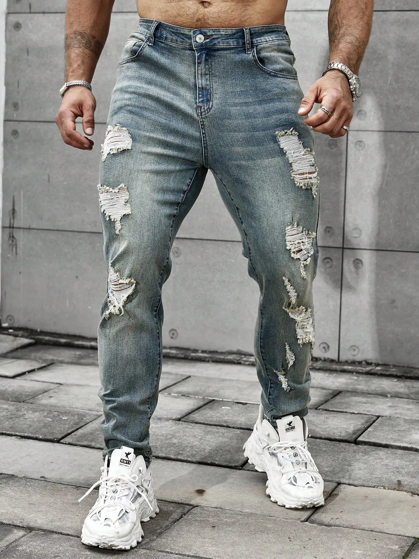 

Men's jeans for spring and autumn. Vintage washed and distressed denim long pants. Street fashion. Daily casual trendy outfits.