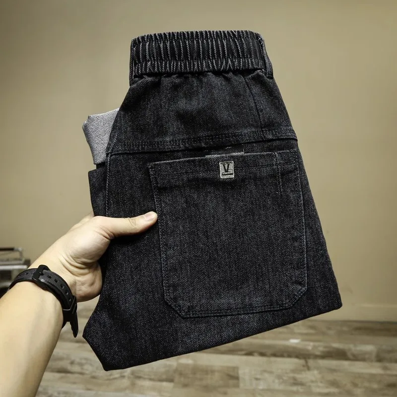 JEANS SLIM FIT ผ้าเดนิมสไตล์ลำลองของผู้ชายแฟชั่นฮาราจูกุกางเกงคาร์โก้ผู้ชายมีสายรัดเอวยางยืดสำหรับฤดูใบไม้ผลิและฤดูใบไม้ร่วง