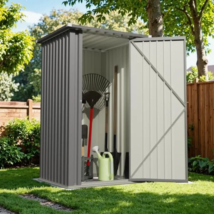 Outdoor storage shed for backyard patio and lawn use, made of metal with sloping roof, gray color, featuring single lockable do