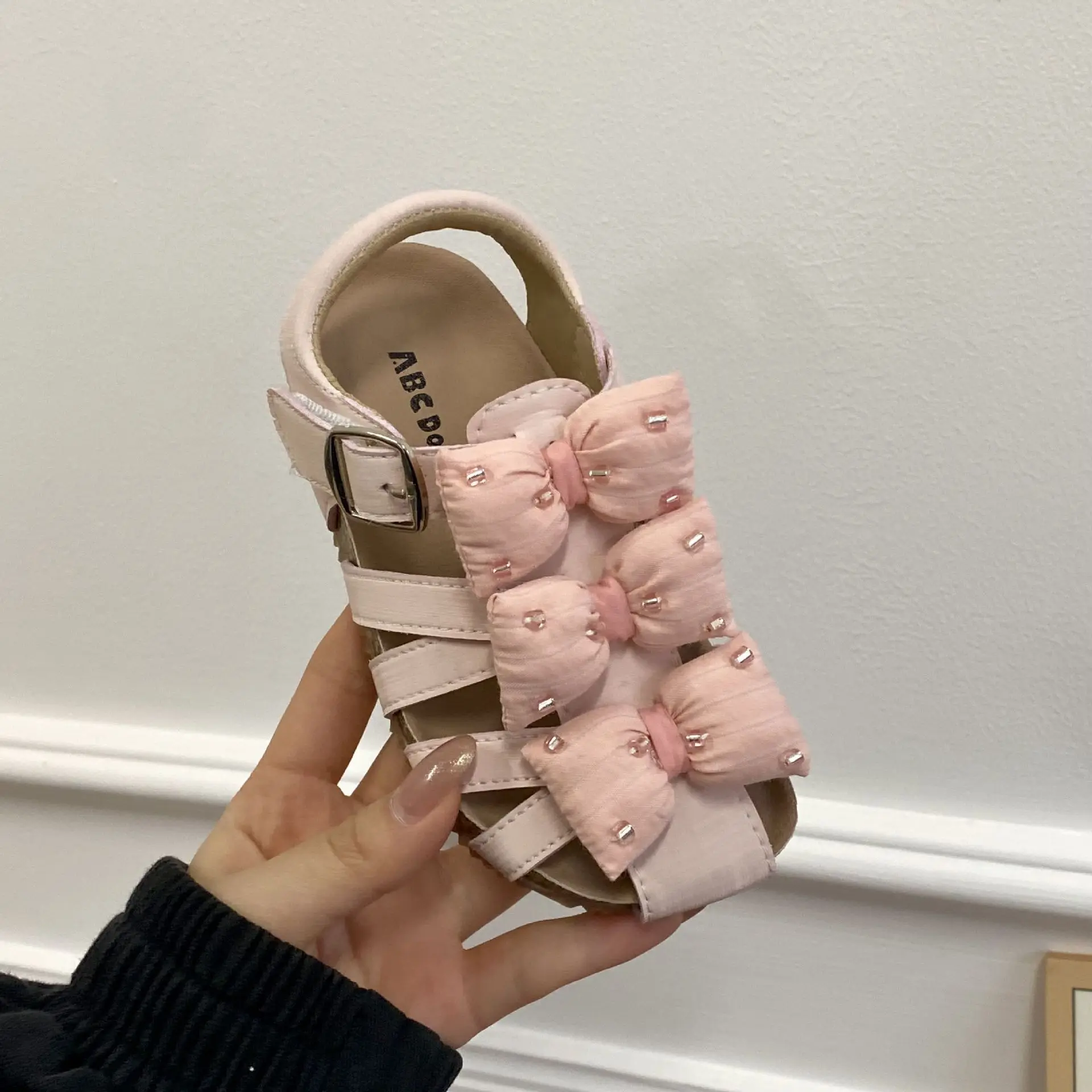 Picture 7: Girls Hollow Out Sandals 2026 Summer Bow Roman Sandals for Kids Breathable Beach Shoes Toddler Princess Sandals