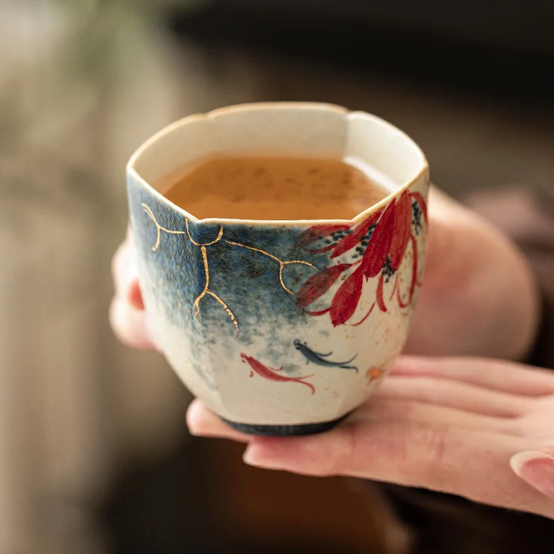 

Blue and white flint red high-end master cup with gold stroke hand-painted lotus rhyme, koi fish, hexagonal cup, ceramic tea cup