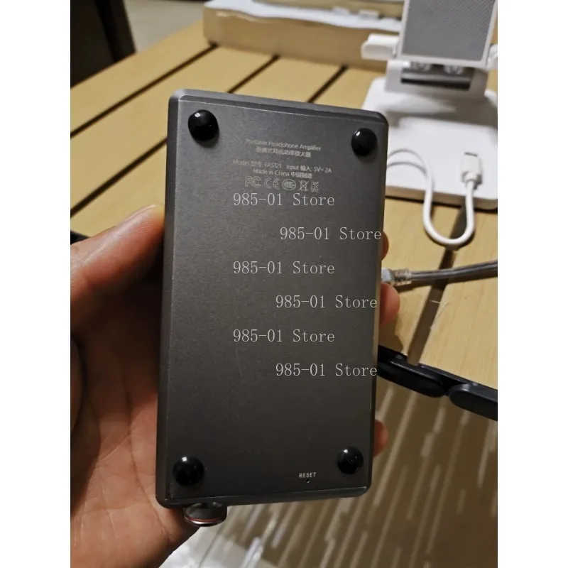Portable headphone amplifier, lightweight wearable audio amplifying device