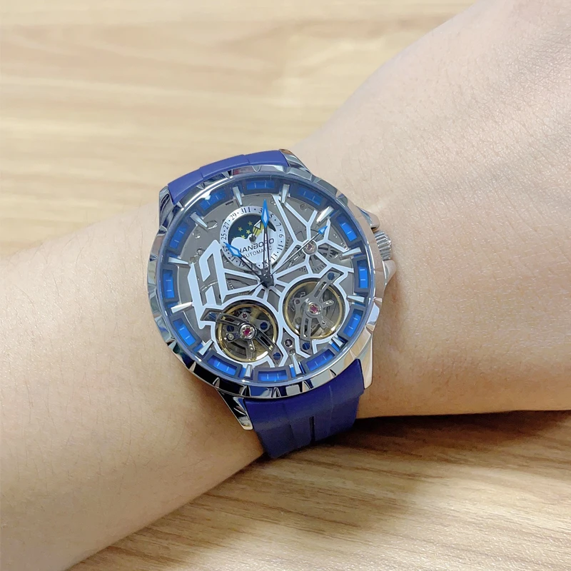 HANBORO ผู้ชายนาฬิกาอัตโนมัตินาฬิกาหรู 50M กันน้ําส่องสว่างนาฬิกาข้อมือ Hollout Out Dial Fly ล้อ Sapphire