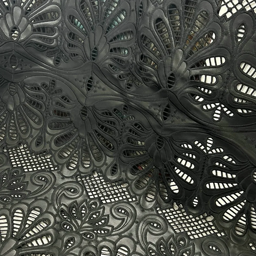 

High-end leather PU base fabric with laser-cut milk silk embroidery hollow PU material for women's clothing, bags, home textiles