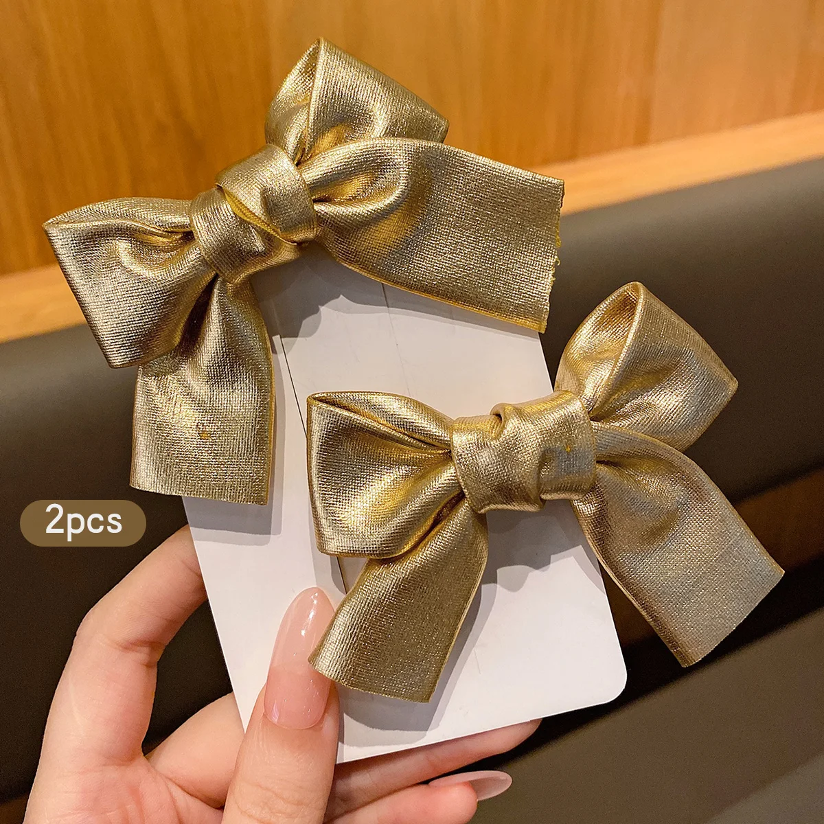 2 gold bow hair clips with elegant hair style suitable for daily use as hair accessories