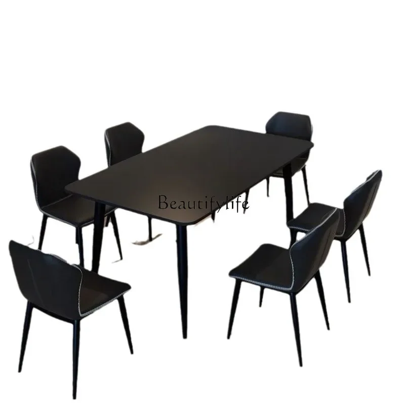 

Minimalist pure black rock slab dining table Small apartment Modern rectangular Italian light luxury dining table