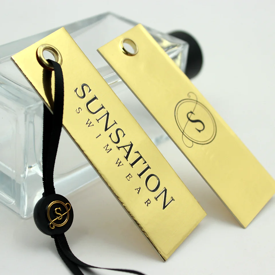 Luxury Custom Embossed Glossy Golden Paper Hang Tag New Clothing 3D Own LOGO Swing Tags with Metal Plating Eyelet Price Label