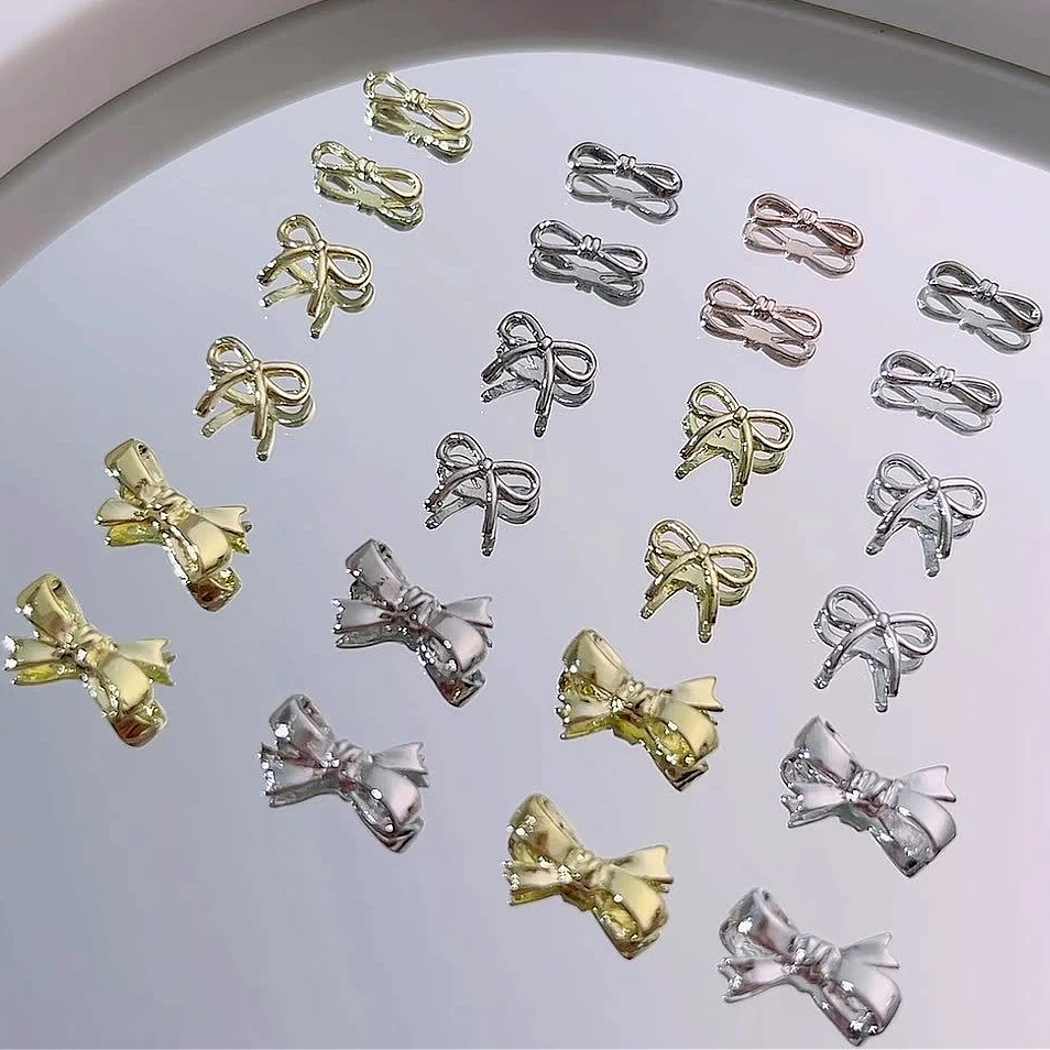 

Korean Cute Alloy Gold Silver Bowknot Gold Silver Bow Tie Ribbon Butterfly Metal Nail Art Decorations Charm Manicure Accessories