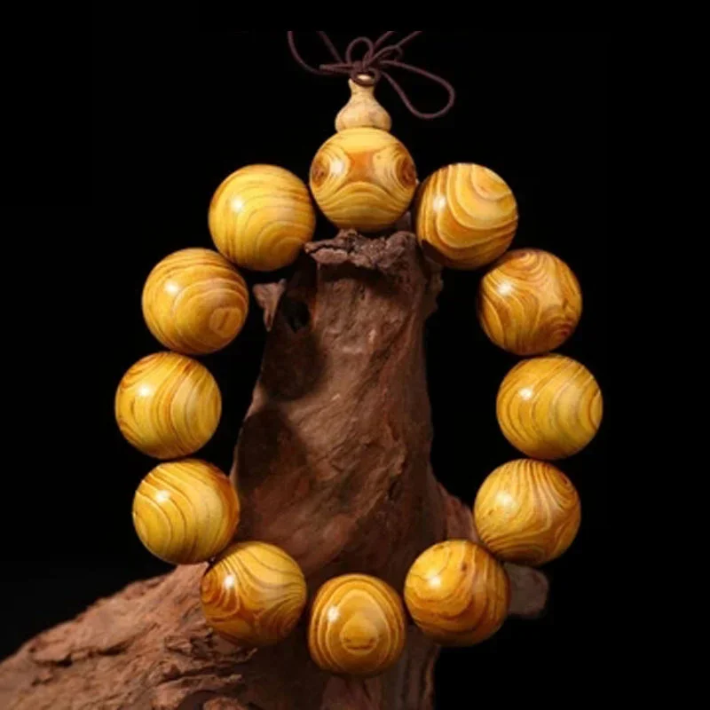 

Gold rimmed pomelo phoebe cross eye sandalwood ghost eye gross bracelet for men and women