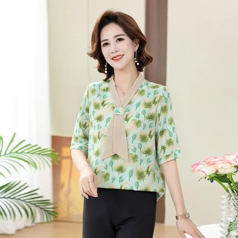 T-shirt a maniche lunghe con scollo a V alla moda con stelle filanti stampate allentate da donna in chiffon