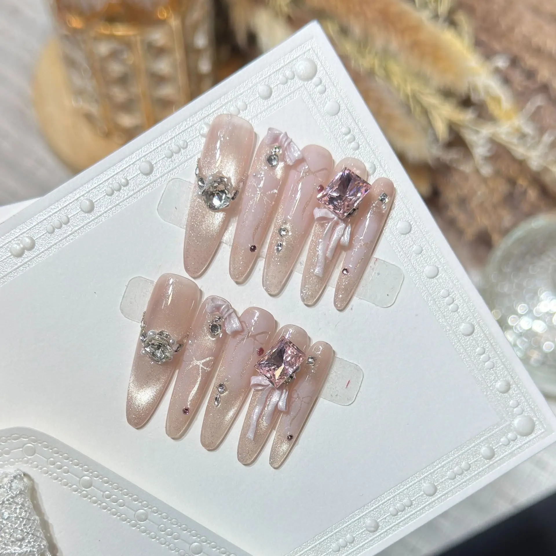 

10pcs Handmade Long Stiletto Press On Nails Shiny Pink Cat Eye Rhinestone Bow Design Gentle Fake Nails Wearable Nails Art Tips