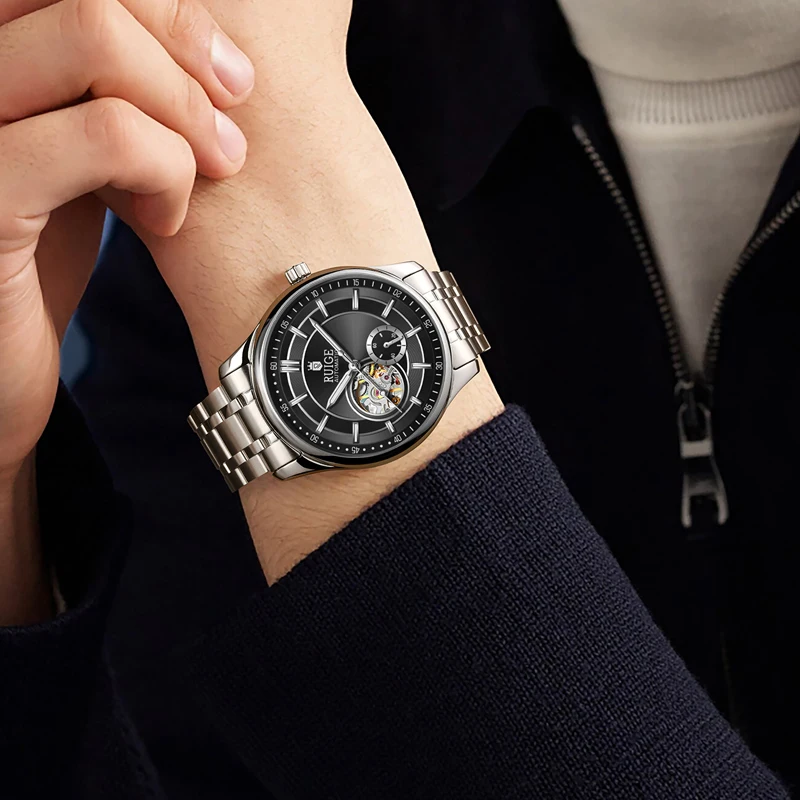 ساعة RUIGE ميكانيكية أوتوماتيكية بتصميم مجوف وحزام من الفولاذ المقاوم للصدأ، ساعة يد رجال الأعمال العصرية.