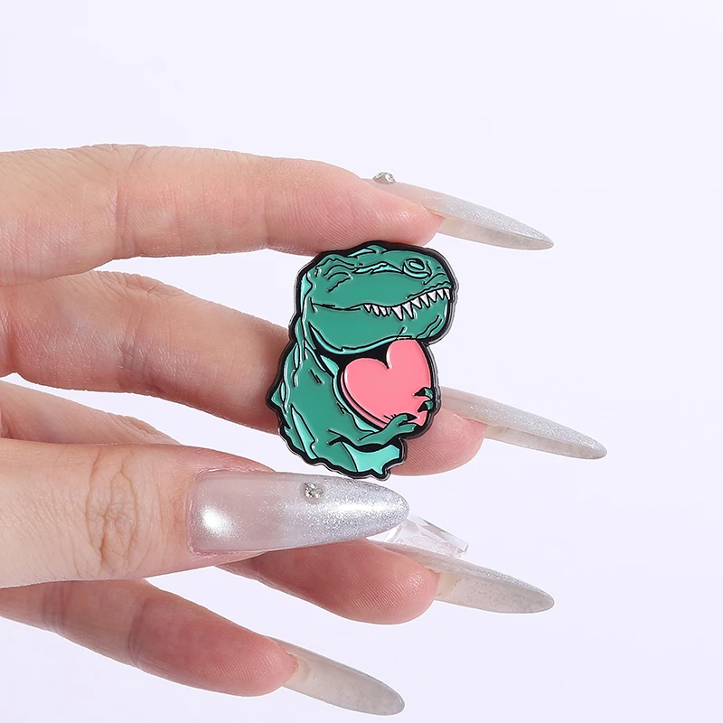 

Dino Holding Heart Enamel Pins Cute Green Dinosaur with Love Heart Brooches Decor Clothes Lapel Badges Jewelry Gift for Friends