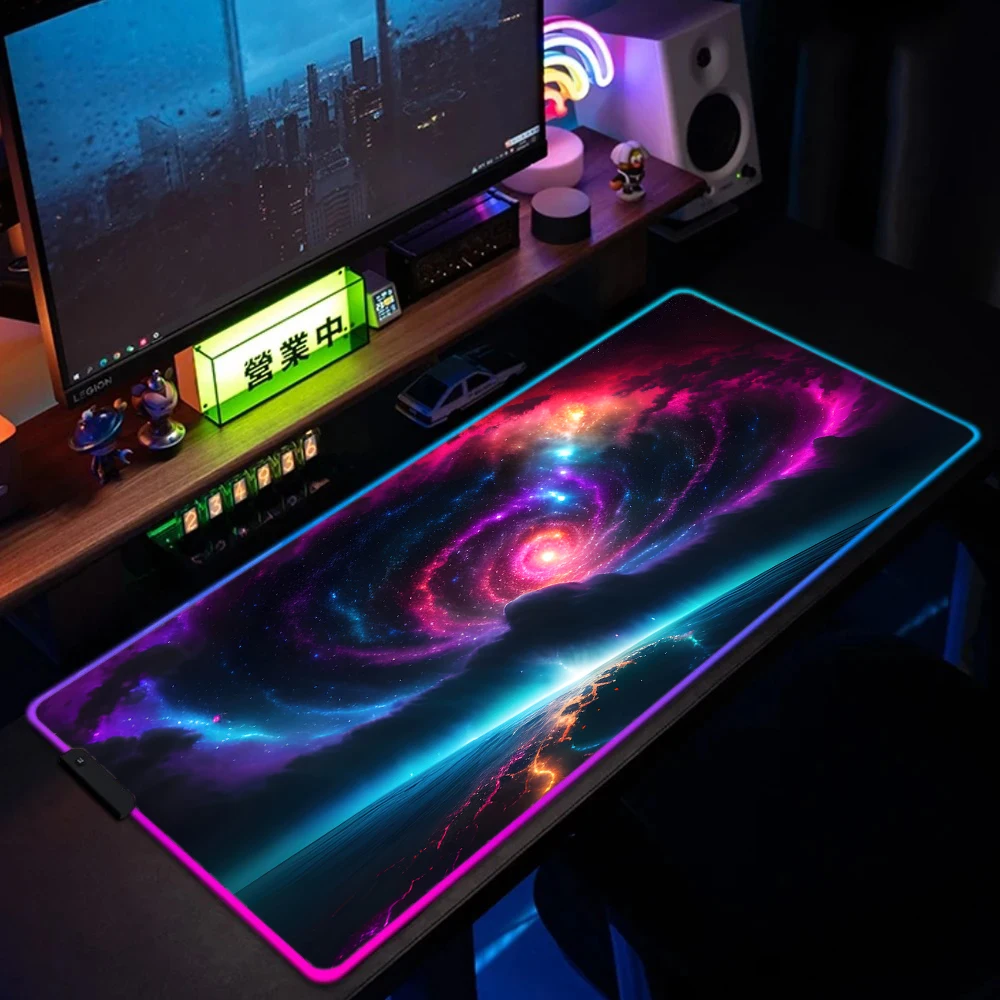 Full desk setup with galaxy LED mouse pad in use