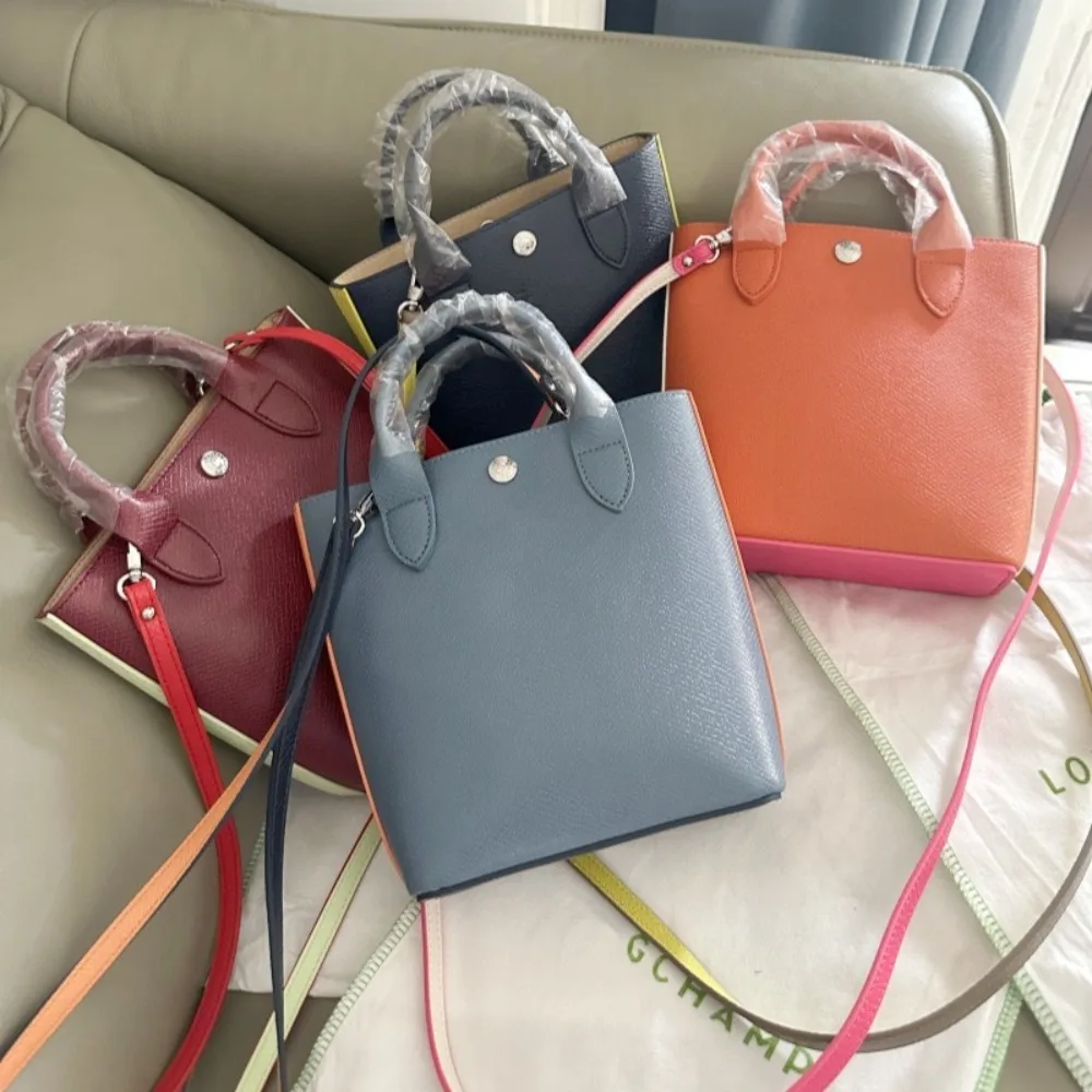 

2025 high-quality new cowhide mini tote bag, color blocking and contrasting handbag, hand-held bucket, women's bag