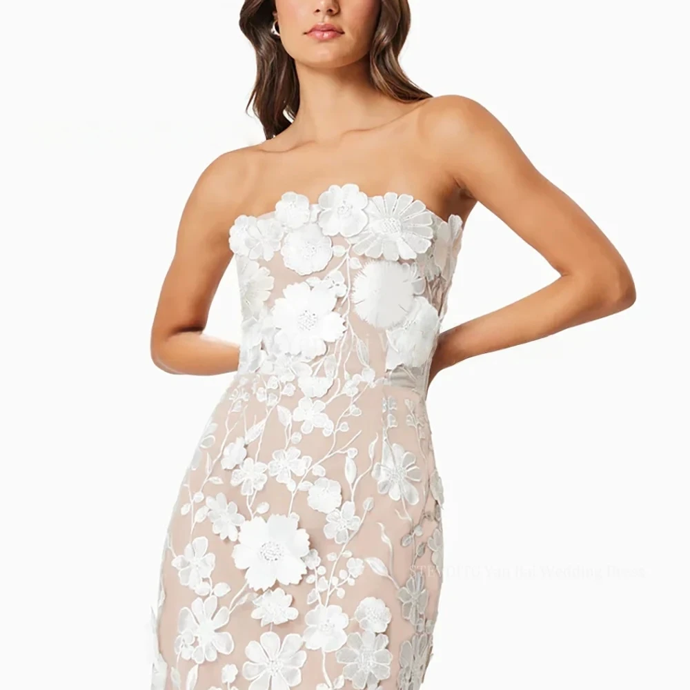 فساتين حفلة موسيقية من الدانتيل على شكل زهرة بيضاء للنساء بدون حمالات بطول الشاي مستقيمة لحفلات أعياد الميلاد حسب الطلب