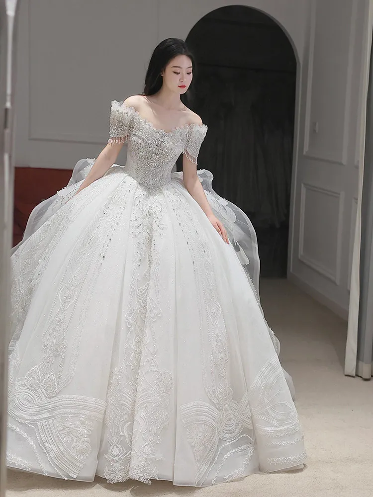 Robes de mariée à paillettes robe de soirée de mariage haut de gamme avec traîne brosse robe de mariée de luxe personnalisée 2026 robes de mariée brillantes