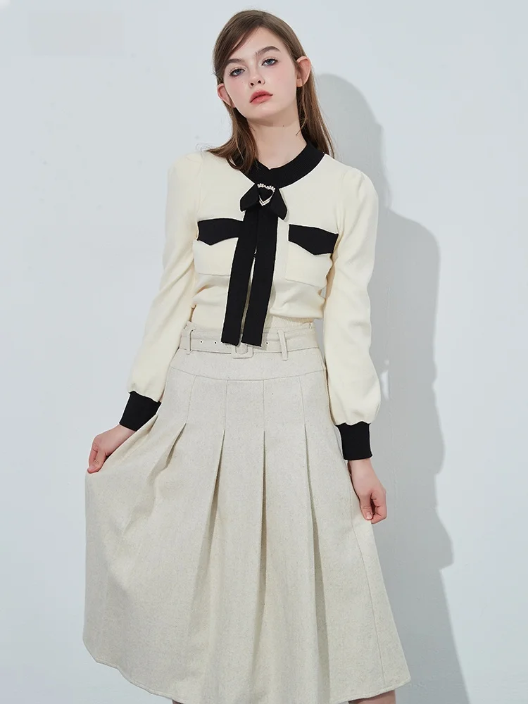 

Вязаный свитер и шерстяная юбка: комплект женской моды для осени и зимы, стильный и элегантный.