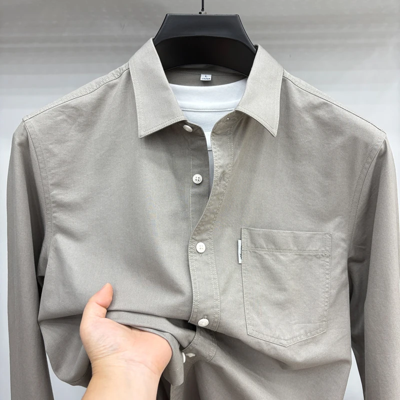 Camisa de lyocell de alta calidad de otoño para hombre, solapa de color sólido, nueva ropa de abrigo de manga larga con bolsillos, tops de moda de ocio para hombre