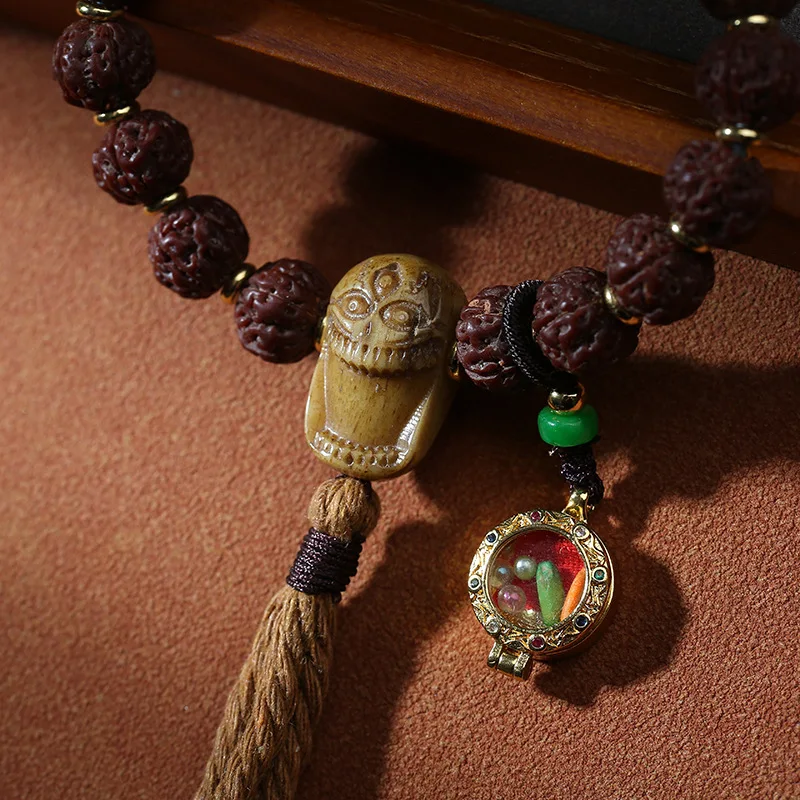 Small Rudraksha prayer beads with a Gahu box, bone -way connector, and three-thread Dzi bead in Tibetan style