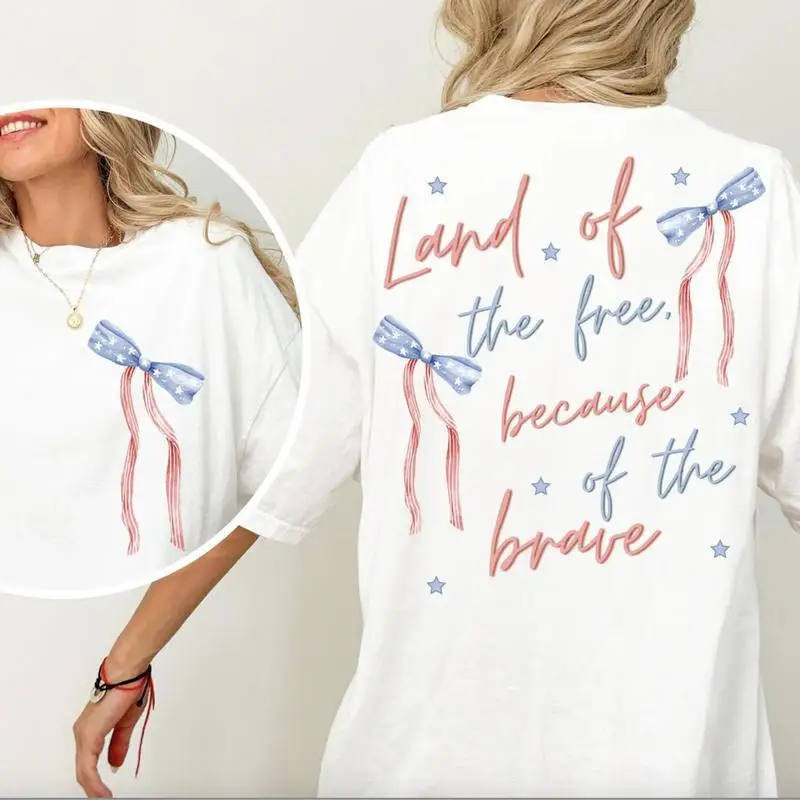 

Land of the Free Because of the Brave T-shirt, Women's 4th of July Patriotic Top, American Flag Ribbon Graphic Tee.