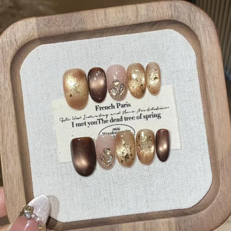 

24 Pcs Brown Cat Eye Press on Nails Medium Short Rhinestones Decorated False Nails for Women Nail Tips Prosthetic Nail Set 2025