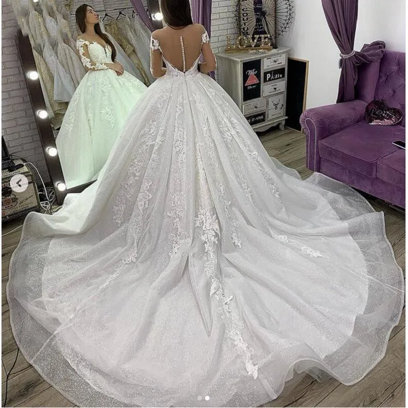 Elegante Witte Trouwjurken Glitter Tulle Kant Applicaties Lange Mouwen Sheer Hals Floor Lengte A Line Bruidsjurken Met Kralen