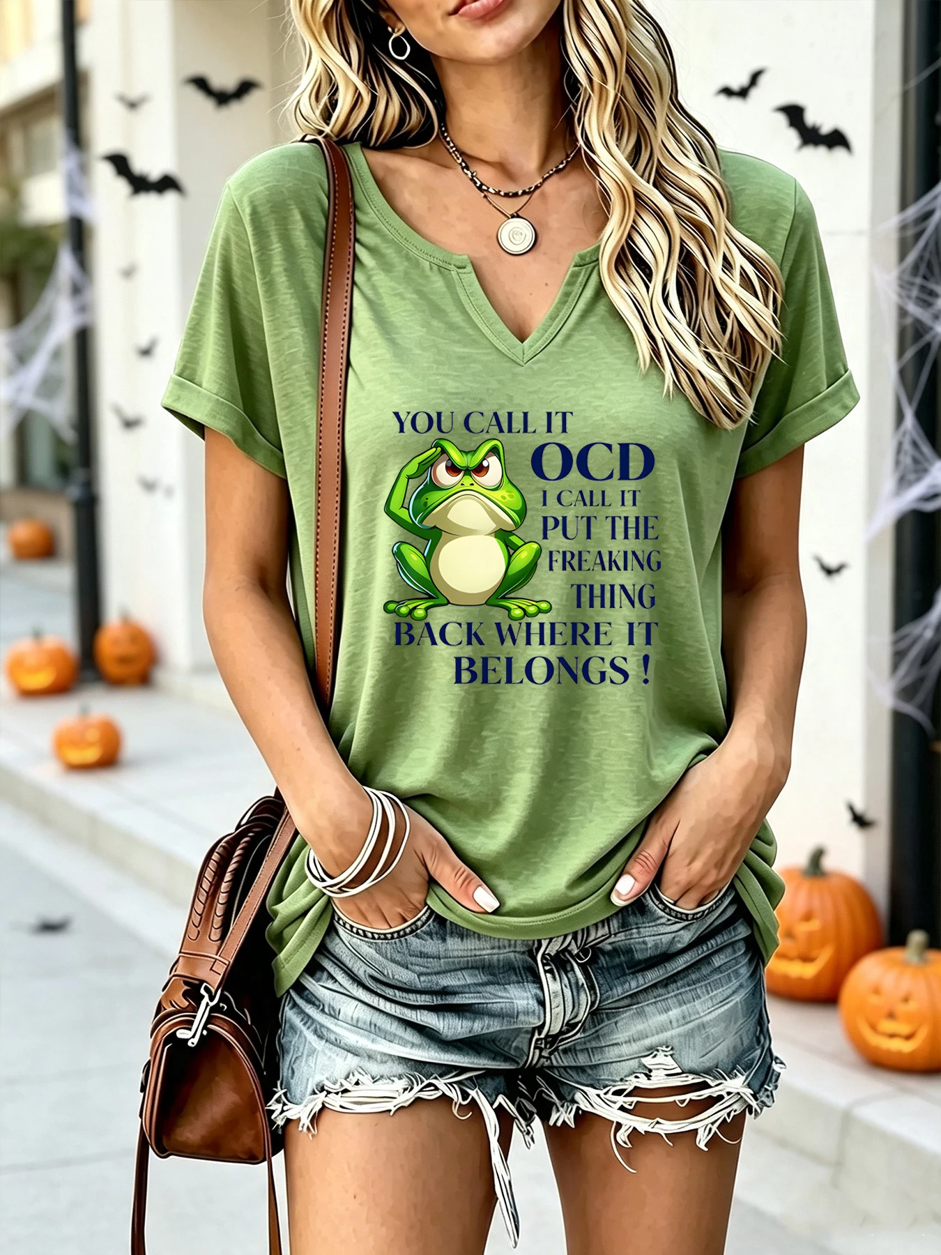 Funny and teasing frog OCD puns printed on fabric. V-neck, rolled cuffs, short sleeves T-shirt. Women's clothing.