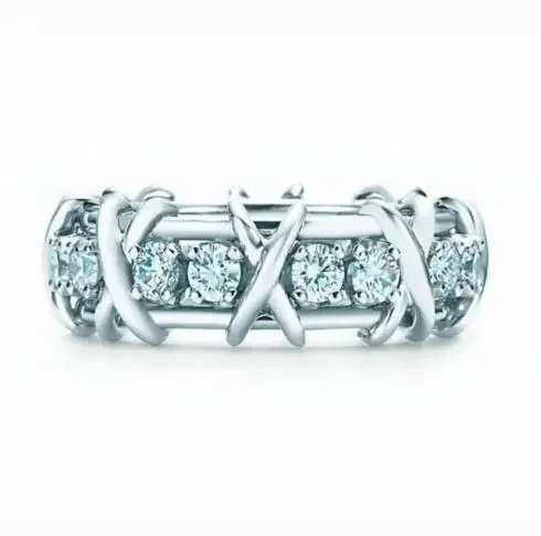 

Sterling Silver Interlocking Crisscross Band Ring with Prong-Set Diamond Accents