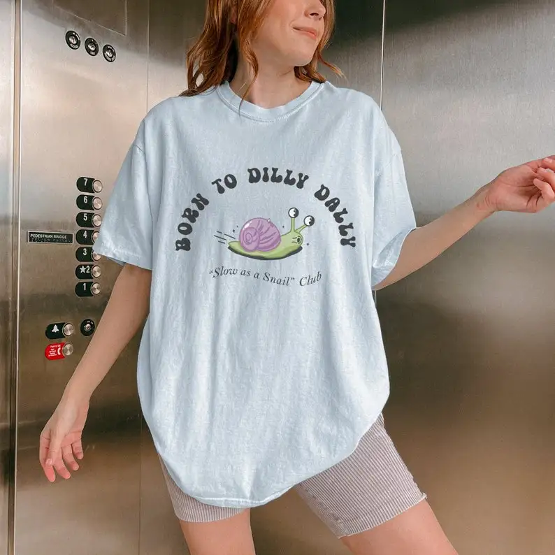 

Retro Snail Graphic Tee Born to Dilly Dally Slow and Steady Lollygaggin Aesthetic Summer Aesthetic Y2K s Retro Teeshirt