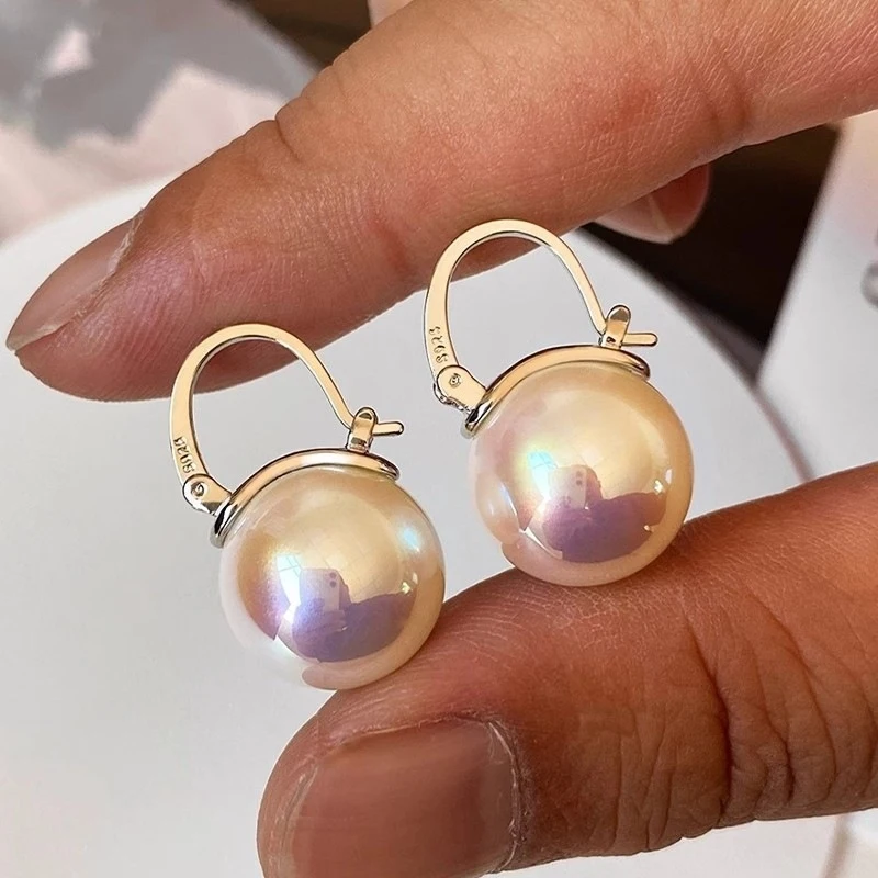 

Aurora Natural Australian Mother-of-Pearl 925 Silver Needle Geometric Round Bead Earrings with Elegant and Sophisticated Design