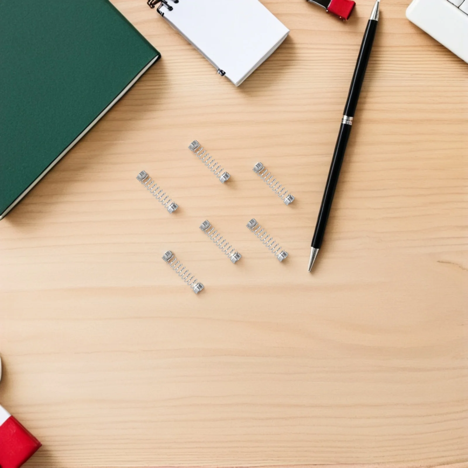 100 قطعة قلم حبر جاف نوابض ضغط الفولاذ المقاوم للصدأ عمل زنبرك صغير للأقلام استبدال نوابض القلم