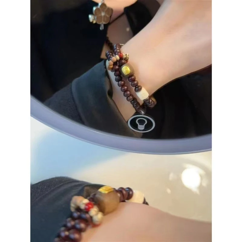 Designed a purple-gold bowl-shaped double-ring bracelet, paired with multi-treasure running rings, five-sutra chess pieces,