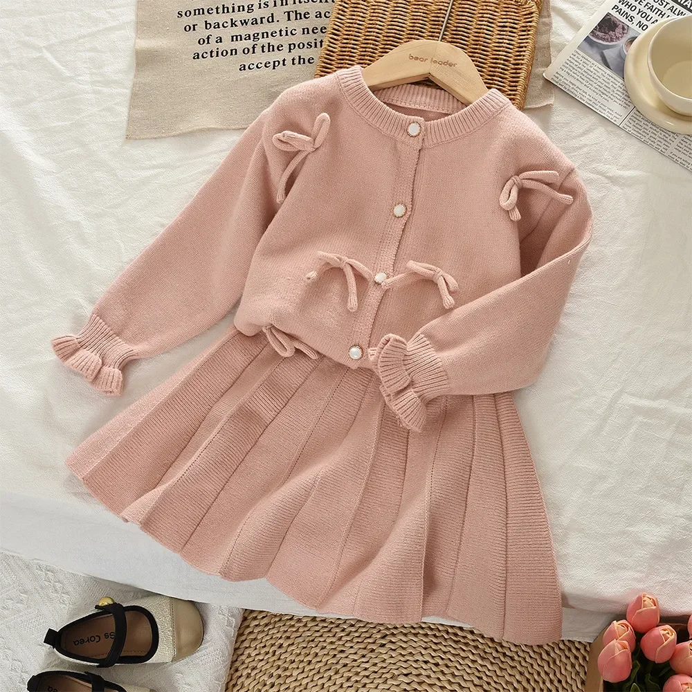2-6 Years Old Cute Baby Girl Clothing with Bow Decoration Solid Color Long Sleeved Cardigan Sweater + Short Skirt Two-piece Set