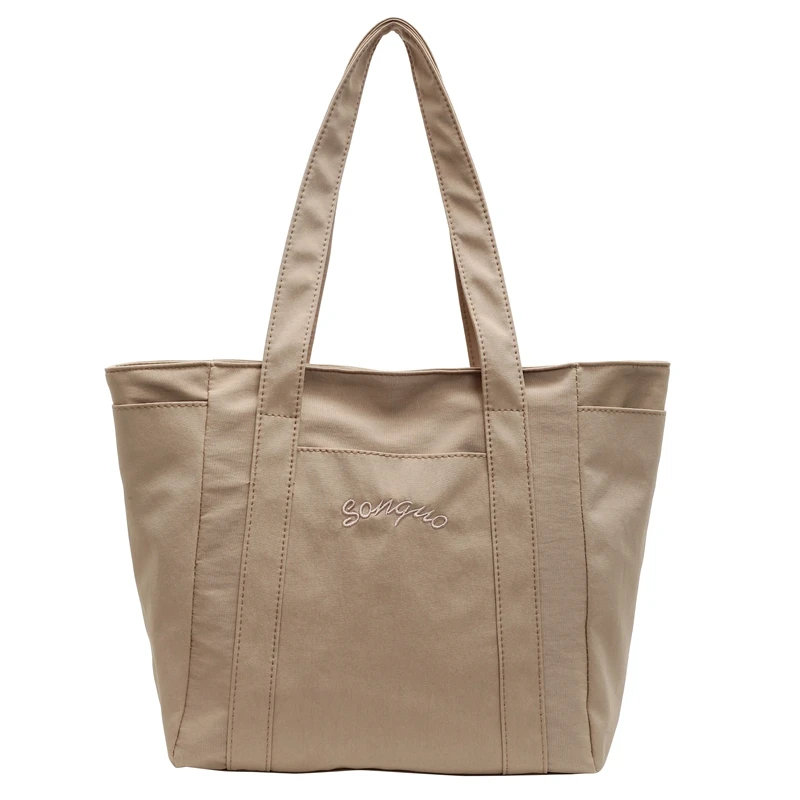 حقائب يد نسائية غير رسمية ذات سعة كبيرة ومتعددة الاستخدامات وسحاب موجز 2025 حقائب كتف جديدة عالية الجودة بلون واحد للتنقل