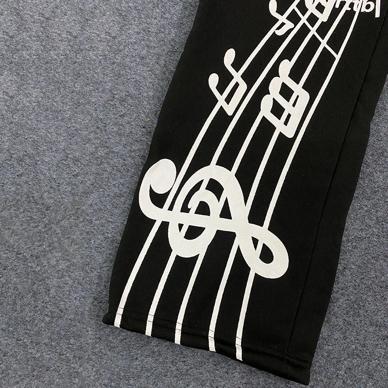 Spodnie American Vintage z lat 2000. Kreatywne, personalizowane litery, nadrukowane spodnie, hip-hopowe, streetwearowe, sportowe, luźne, elastyczne spodnie do joggingu.