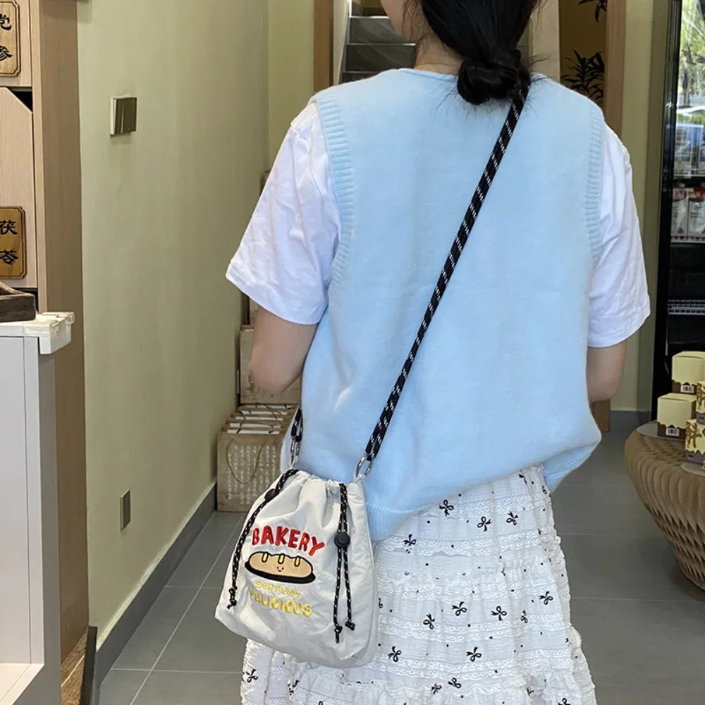 

Cartoon Nylon Shoulder Bag Embroidery Multicolor Drawstring Crossbody Bag Korean Style Large Capacity Mobile Phone Pack Sports