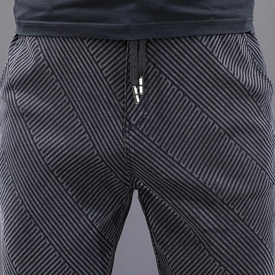 Pantalones vaqueros de talla grande para hombre, pantalón informal de cintura elástica a la moda, diseño de rayas, 8XL