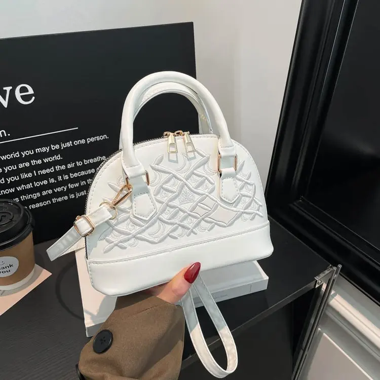 

Высококачественная текстурированная женская сумка кросс-боди 2026: Новая винтажная минималистичная универсальная сумка через плечо