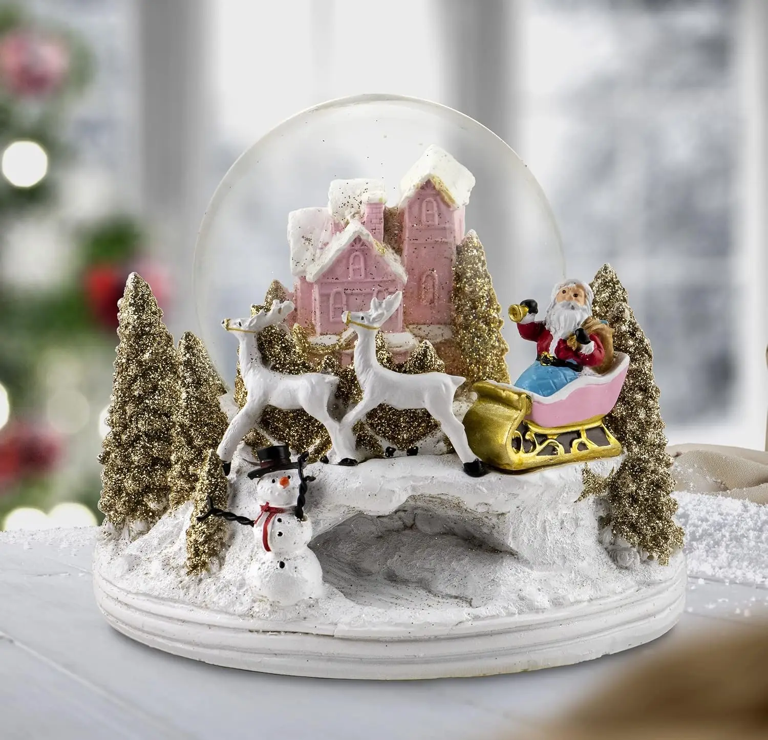 Pink Cottage Snow Globe Featuring Santa and Reindeer