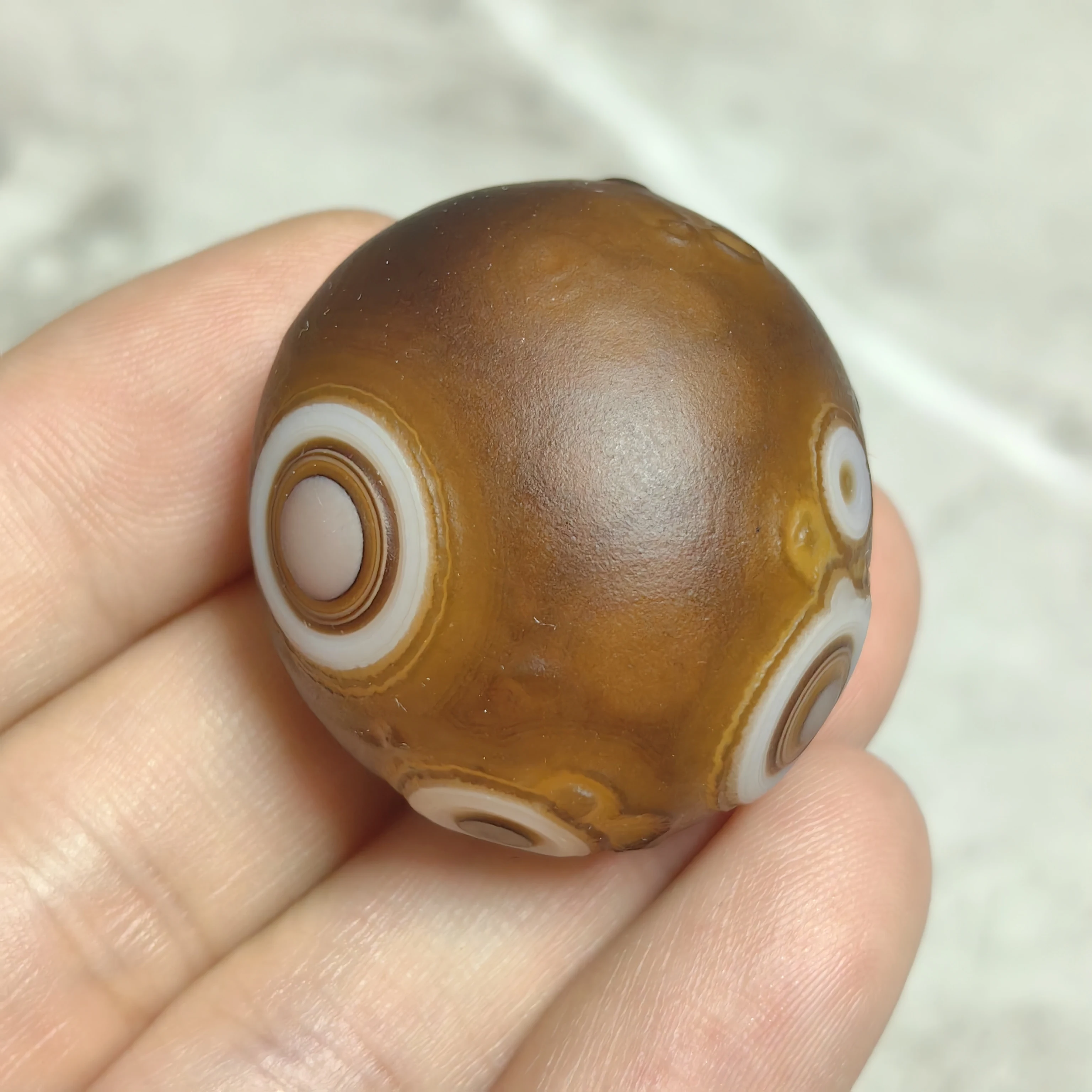 Exquisite Gobi Agate Sphere with Dynamic Flowing Patterns and Prominent Eye Features, Ideal for Interior Accent or Unique Gift