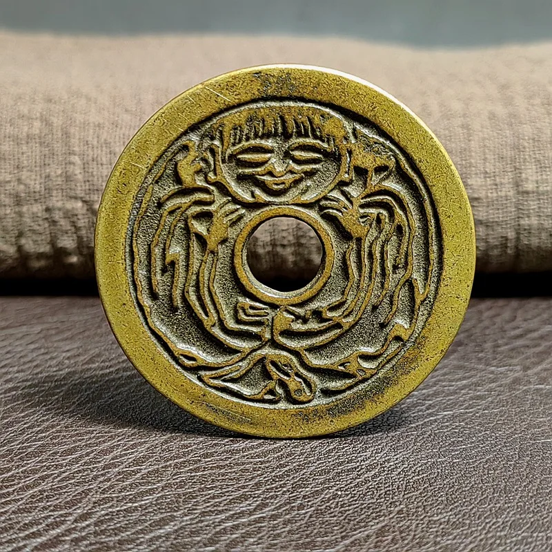 Antique: A round coin with a circular hole, a money amulet, shiny and bright, with a patina passed down through generations, a g