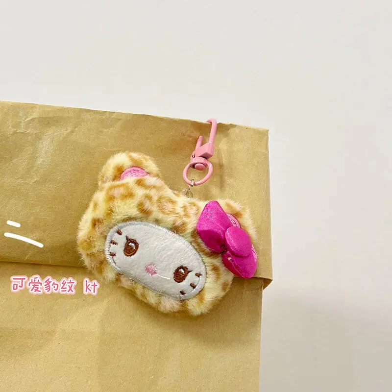 Sanrio Hello Kitty Leopardenmuster Cinnamoroll Plüschtier Rucksack Anhänger Cartoon Paar Schlüsselanhänger Zubehör Freund Geburtstagsgeschenk