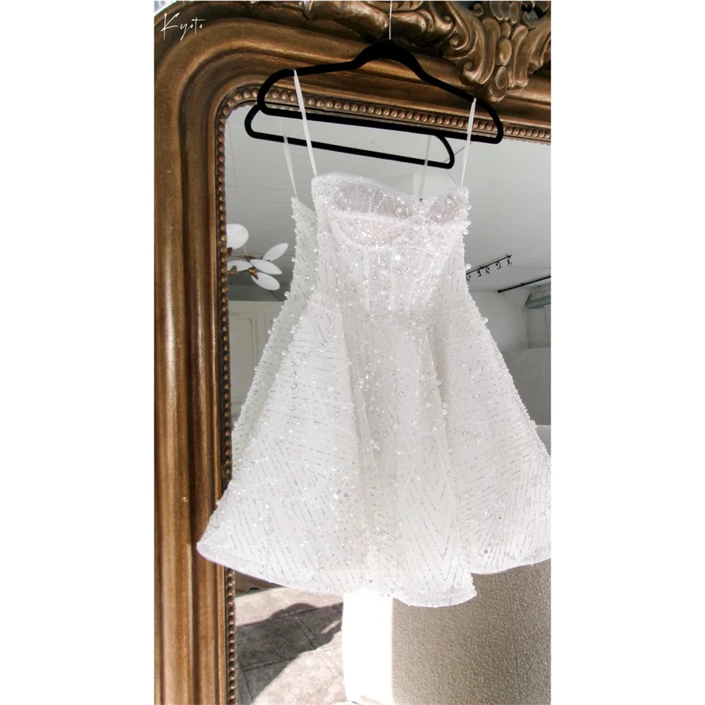 فستان زفاف كيوتو مخصص بأشرطة سباغيتي بيضاء لؤلؤ لامع على شكل حرف a صغير فيستدوس دي نوش الأميرة بعد الحفلات 2025 #1