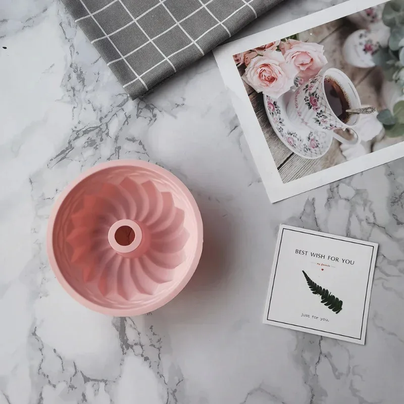A silicone cake mold, specifically designed for circular ovens, is a household dining utensil