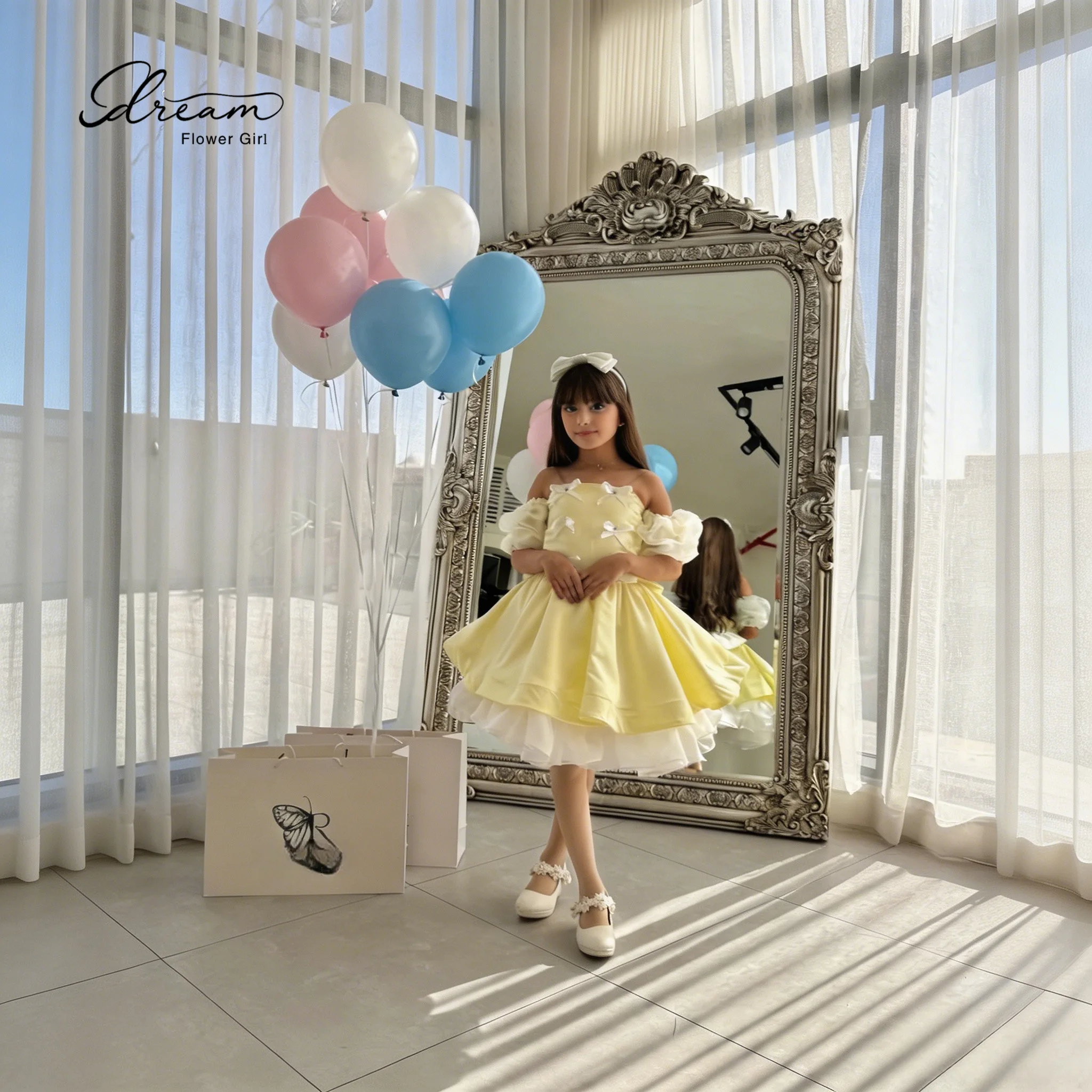 Bright yellow off-shoulder and knee-length party dress, with a large bow decoration on the back.