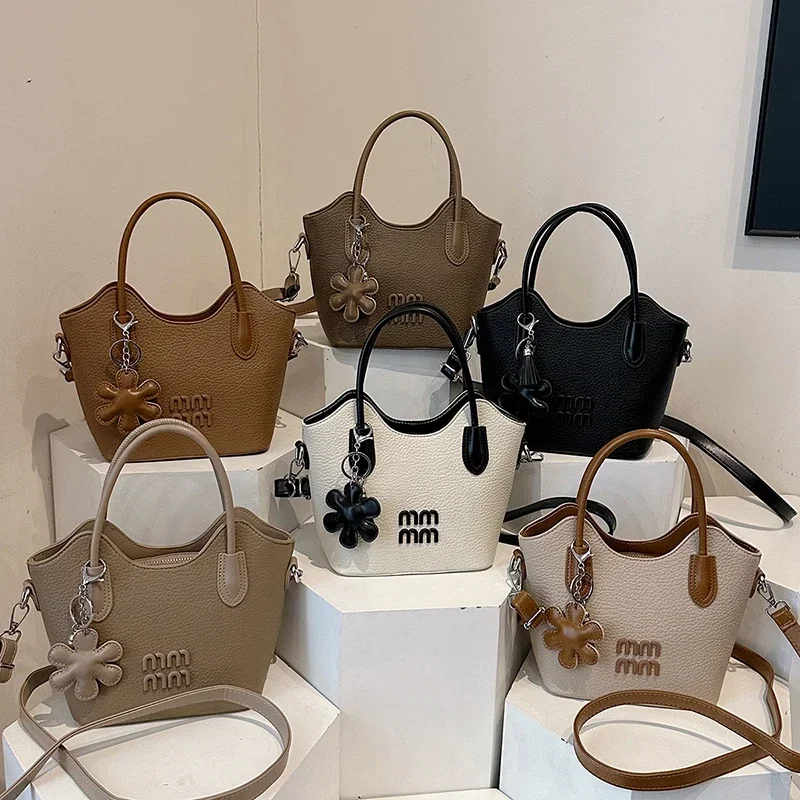 

Chic Minimalist Satchel For Ladies As A Versatile Shoulder Bag And Spacious Commuter Tote Including Diaper Bag Feature