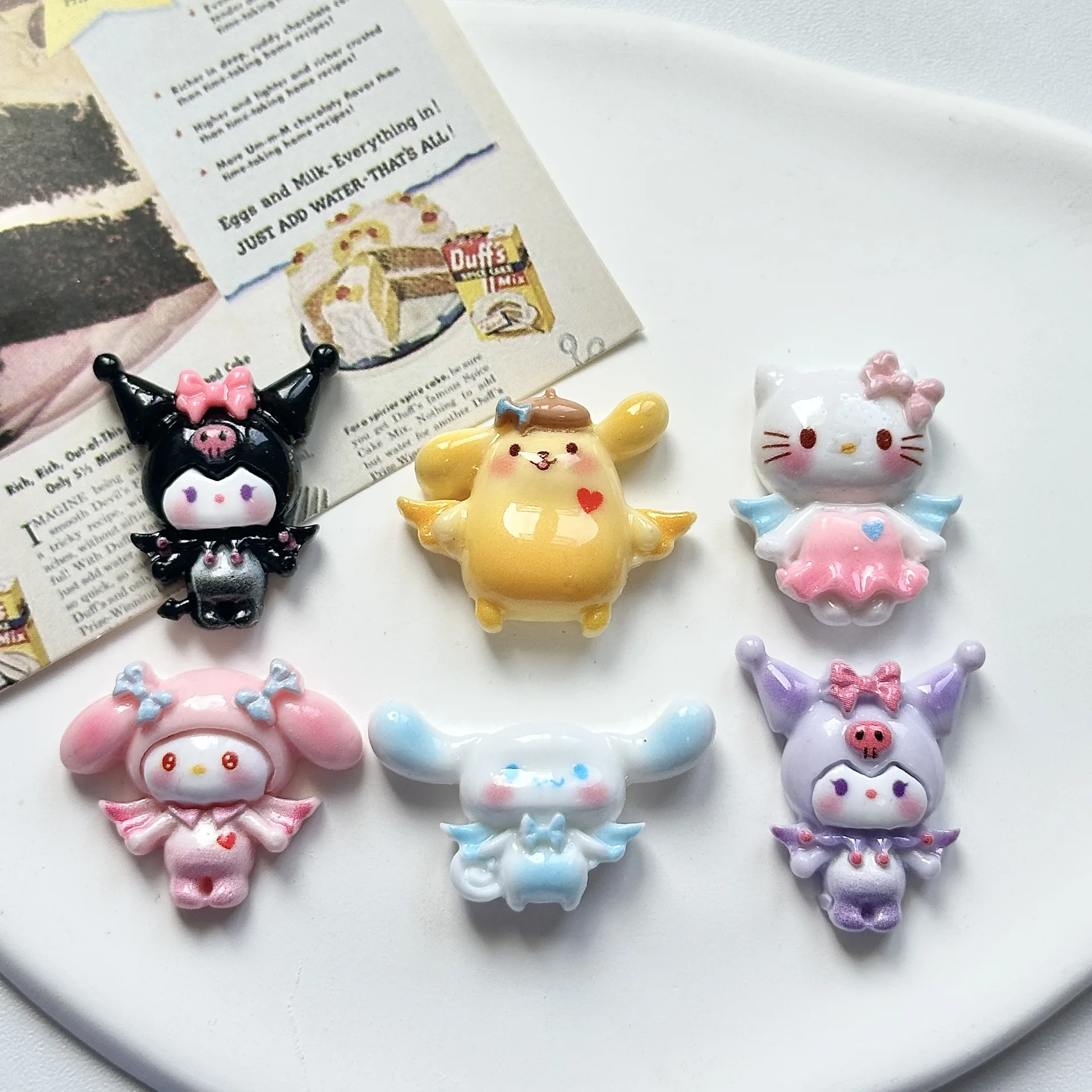 

Miniso's new cartoon angel wings Sanlio cream glue DIY accessories accessories mobile phone case hair clip hole shoe accessories